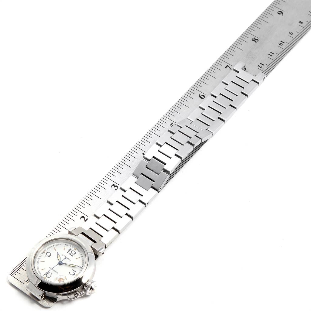 The image shows the face and bracelet length of a Cartier Pasha W31044M7 Stainless Steel White Dial W31044M7 Stainless Steel White Dial watch measured against a ruler.