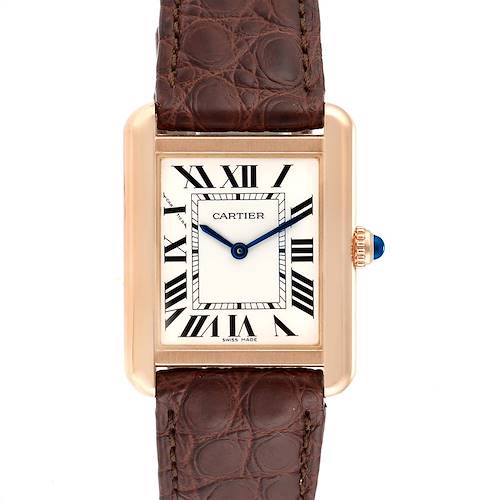 The image shows a top view of a Cartier Tank Solo W5200024 Women's Steel and Gold (two tone) Silver Dial W5200024 Women's Steel and Gold (two tone) Silver Dial watch, highlighting its rectangular face, Roman numerals, and brown leather strap.