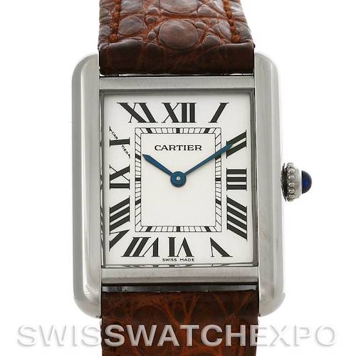 The image shows the face of a Cartier Tank Solo W1018255 Women's Stainless Steel Silver Dial W1018255 Women's Stainless Steel Silver Dial watch, highlighting its rectangular dial, Roman numerals, blue hands, and brown leather strap.