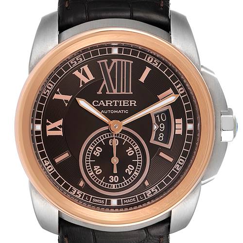 The image shows a frontal view of a Calibre de Cartier watch by Cartier, highlighting the dial, hands, and date display.