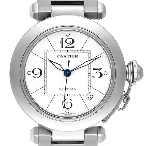 The image shows a top view of the Pasha de Cartier watch, highlighting the dial, numerals, hands, and crown.