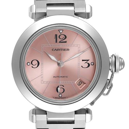 This image shows a close-up view of the Cartier Pasha W31075M7 Women's Stainless Steel Pink Dial W31075M7 Women's Stainless Steel Pink Dial watch face, including its silver bezel, rose gold dial, and metallic lugs.