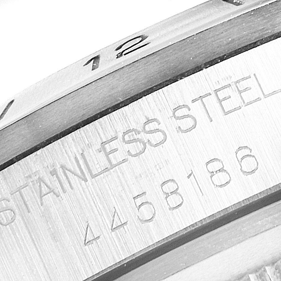 Close-up of the side and bezel of a Rolex Explorer 1655 Men's Stainless Steel Black Dial 1655 Men's Stainless Steel Black Dial watch showing the engraved serial number and "STAINLESS STEEL" text.