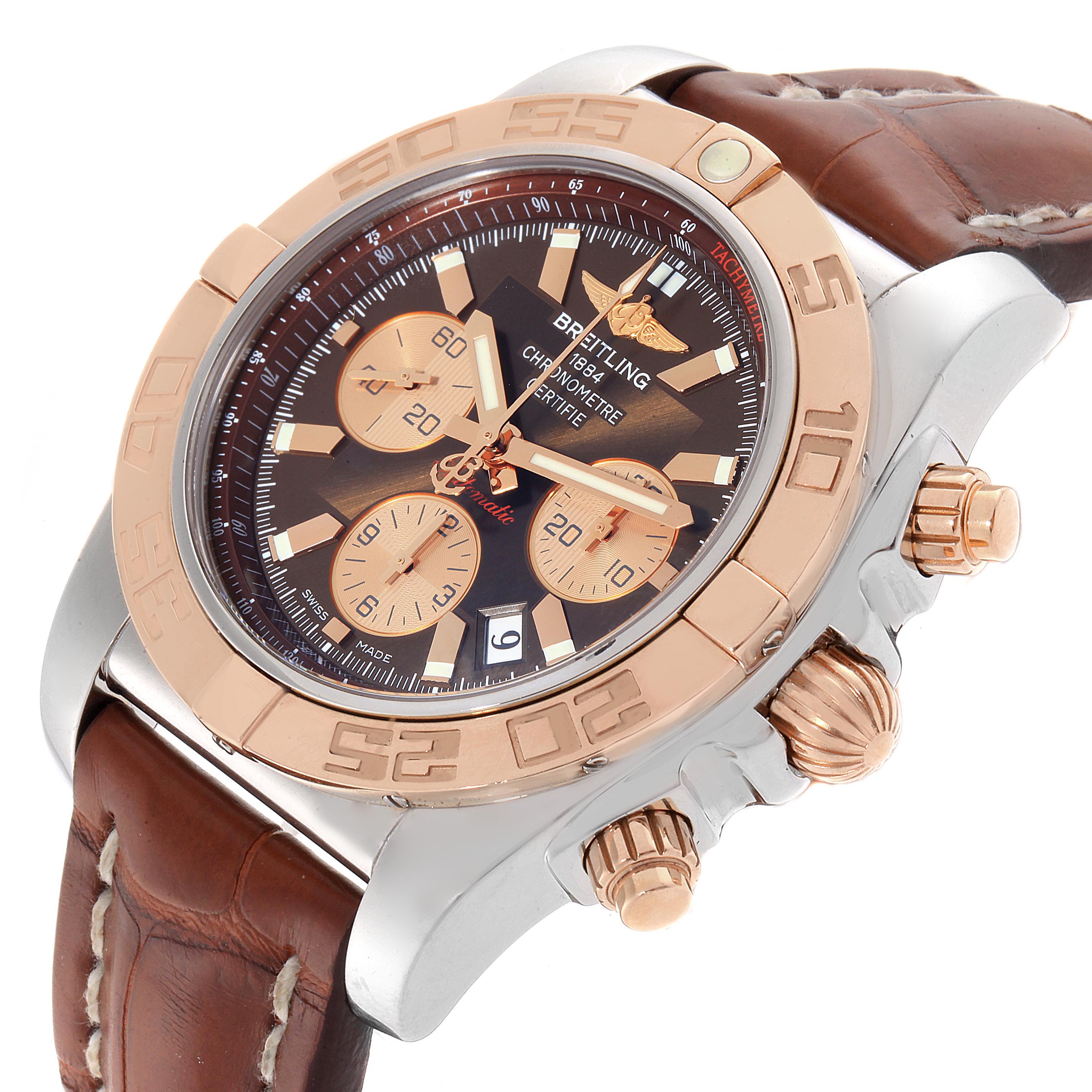 The image shows a close-up angle of the Breitling Chronomat CB0110 Men's Steel and Gold (two tone) Brown Dial CB0110 Men's Steel and Gold (two tone) Brown Dial watch, highlighting its dial, bezel, crown, and strap.