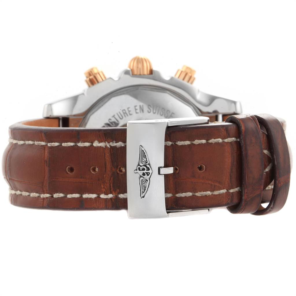 The image shows the back view of the Breitling Chronomat CB0110 Men's Steel and Gold (two tone) Brown Dial CB0110 Men's Steel and Gold (two tone) Brown Dial watch, focusing on the leather strap and metal clasp.