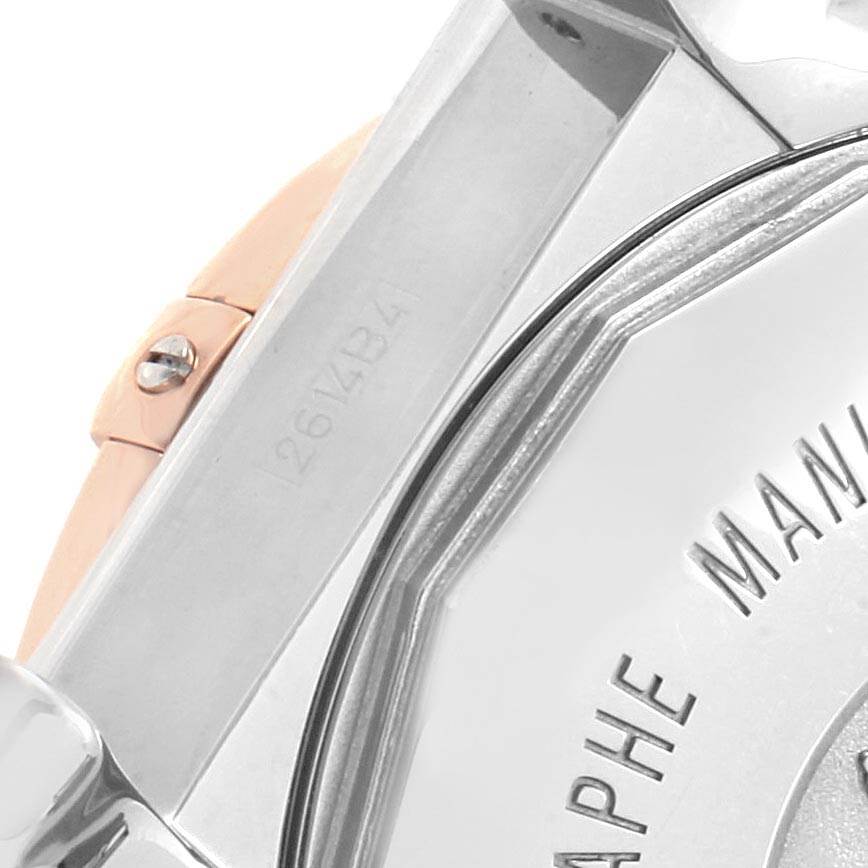 The image shows a close-up of the caseback and part of the bracelet of the Breitling Chronomat CB0110 Men's Steel and Gold (two tone) Brown Dial CB0110 Men's Steel and Gold (two tone) Brown Dial watch.