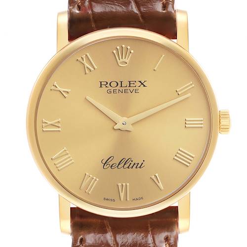 The Rolex Cellini 5115 Men's Yellow Gold Champagne Dial 5115 Men's Yellow Gold Champagne Dial watch is shown from the front, displaying its gold dial, Roman numerals, and brown leather strap.