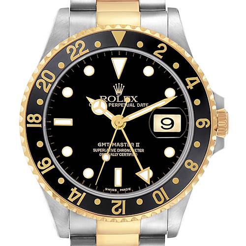 The Rolex GMT-Master 16713 Men's Steel and Gold (two tone) Black Dial 16713 Men's Steel and Gold (two tone) Black Dial II watch is shown from the front, highlighting the black dial, gold bezel, date window, and part of the bracelet.
