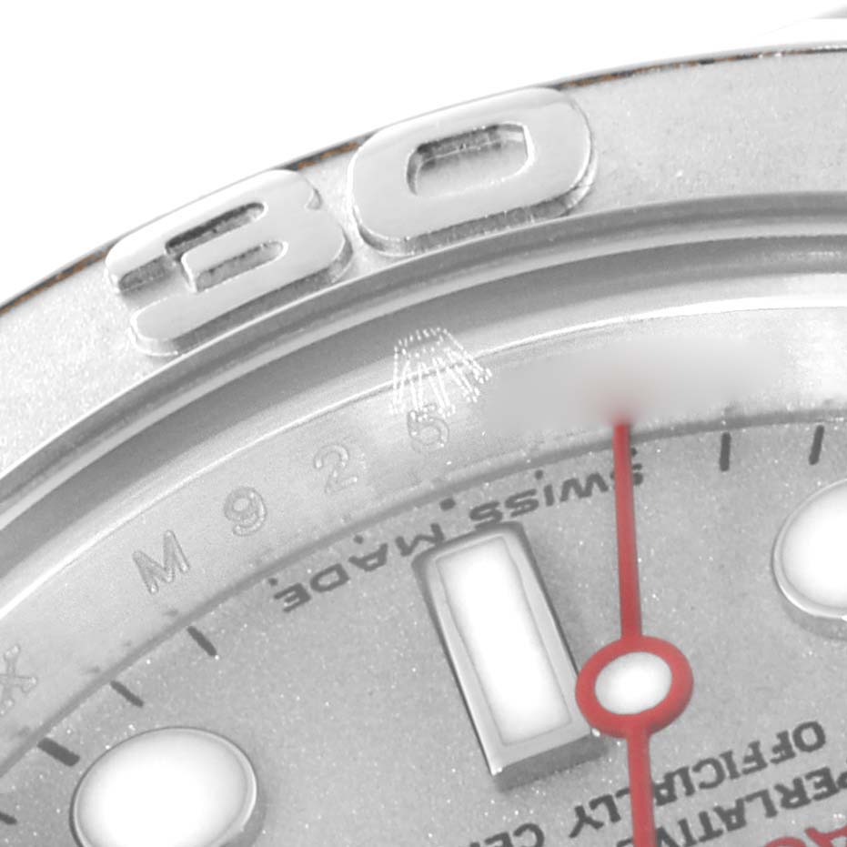 This close-up of a Rolex Yacht-Master 169622 Women's Stainless Steel Silver Dial 169622 Women's Stainless Steel Silver Dial watch shows the bezel and part of the face with markers and text.
