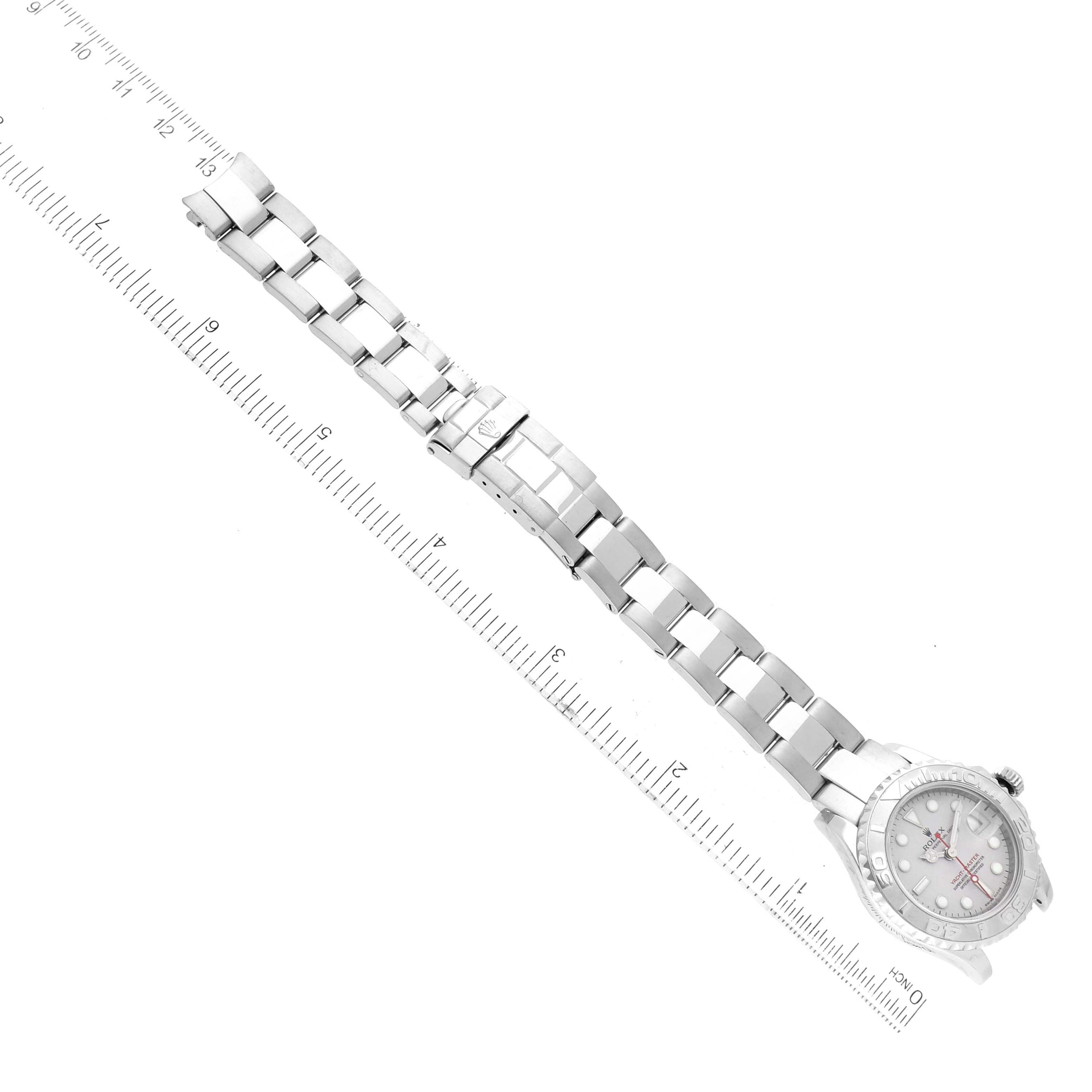 The image shows a Rolex Yacht-Master 169622 Women's Stainless Steel Silver Dial 169622 Women's Stainless Steel Silver Dial watch laid flat, displaying the bracelet, clasp, and dial next to a ruler.
