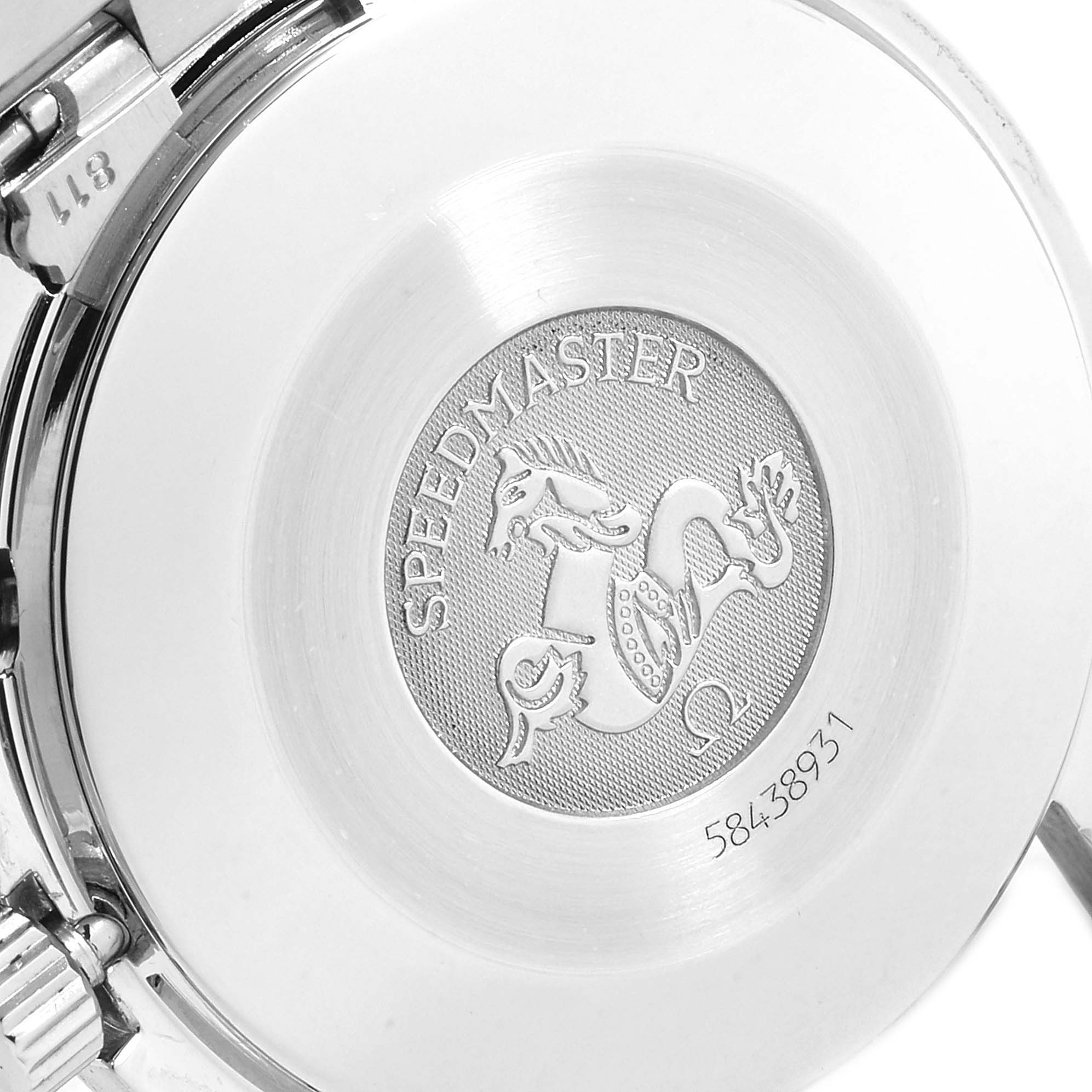 The image shows the engraved case back of an Omega Speedmaster 3510.82.00 Men's Stainless Steel Blue Dial 3510.82.00 Men's Stainless Steel Blue Dial watch from an angled view.