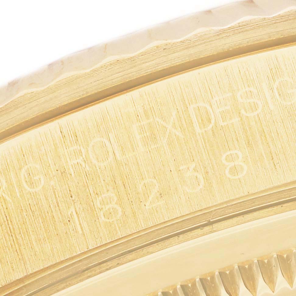 This close-up image shows the engravings on the case side of a Rolex President 18238 Men's Yellow Gold Mother of Pearl Dial 18238 Men's Yellow Gold Mother of Pearl Dial model watch.