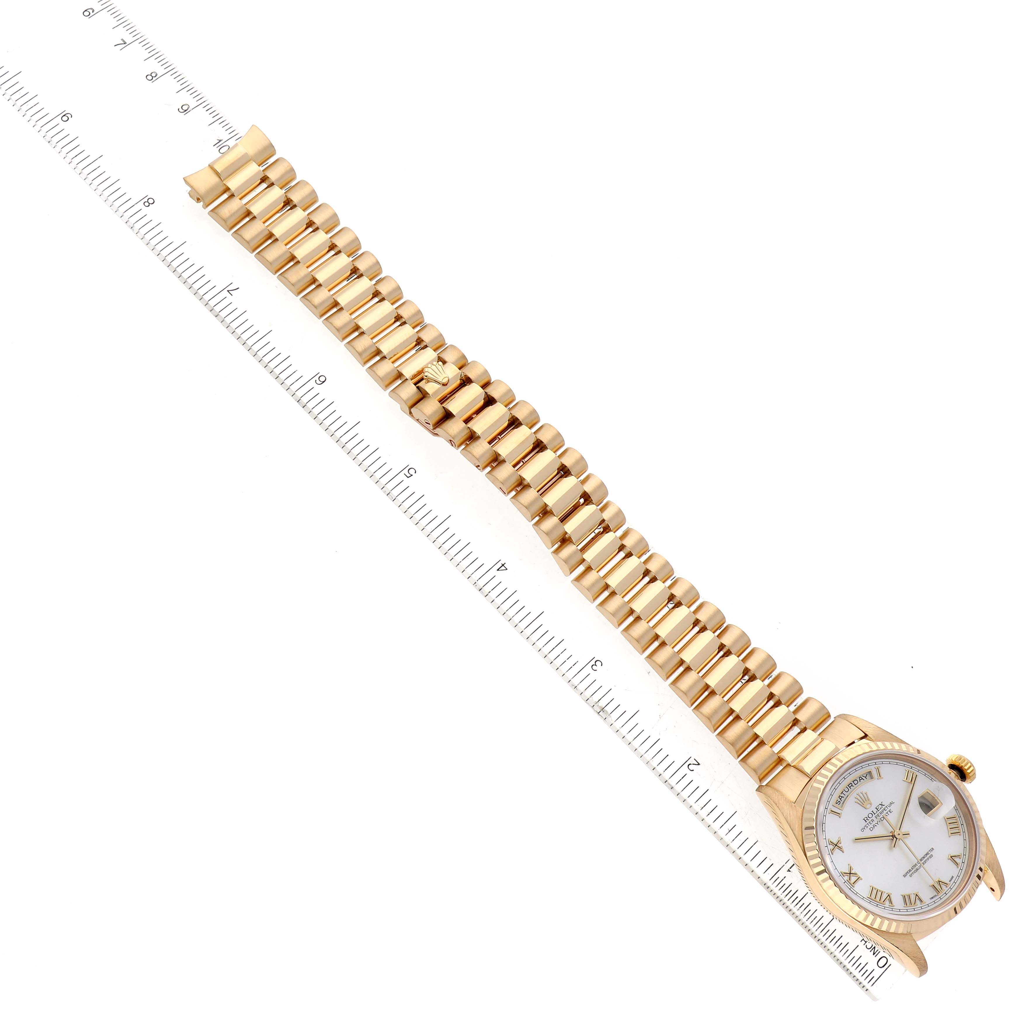 The image shows a Rolex President 18238 Men's Yellow Gold Mother of Pearl Dial 18238 Men's Yellow Gold Mother of Pearl Dial model watch laid flat with its gold bracelet and dial fully visible, alongside a measuring ruler.