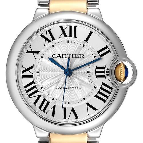This image shows a close-up of the face and crown of the Ballon Bleu de Cartier watch, highlighting the Roman numerals and blue hands.