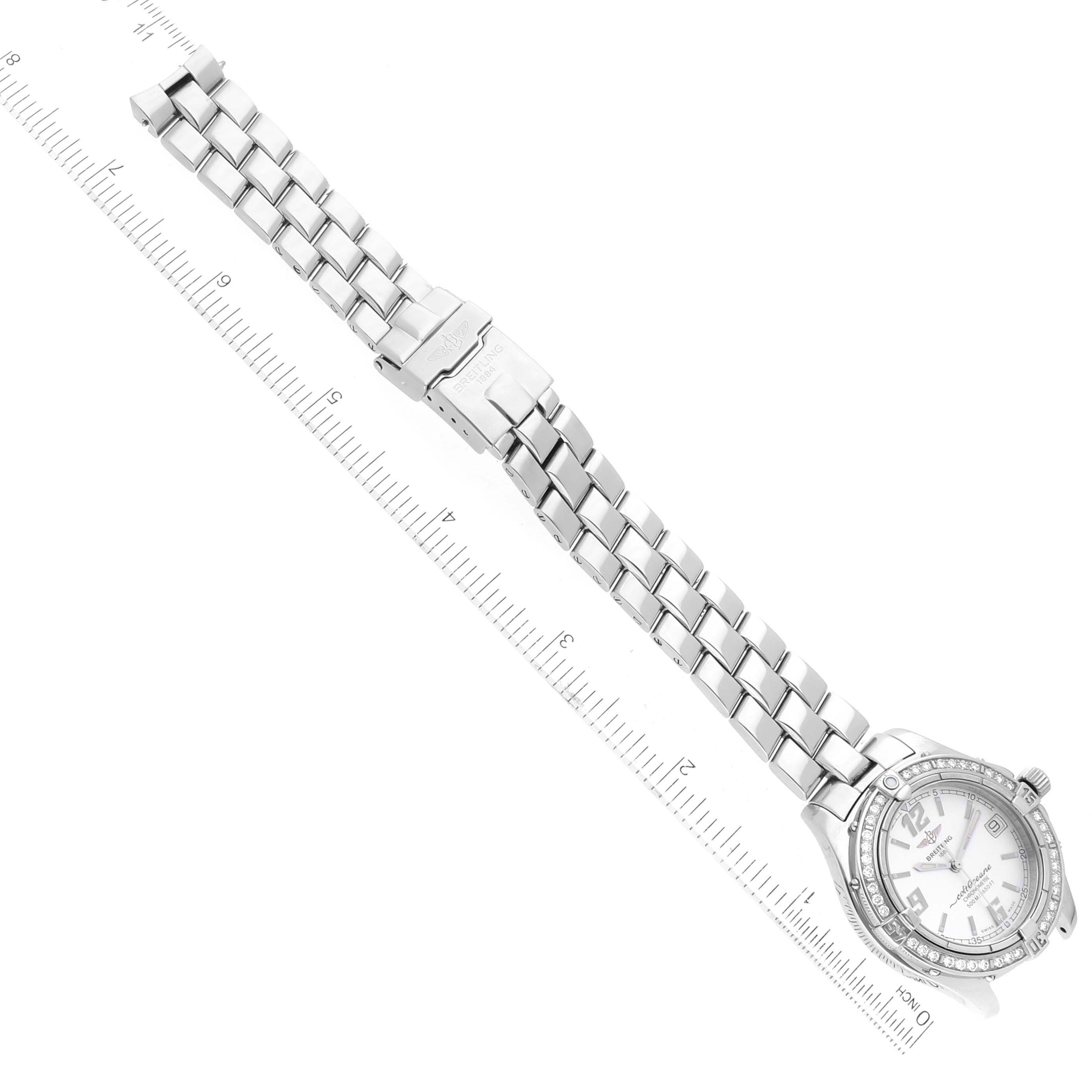 The image shows a Breitling A57350 Women's Stainless Steel Silver Dial A57350 Women's Stainless Steel Silver Dial Colt Oceane Silver Dial Diamond Steel Ladies Watch A57350, viewed from above with its bracelet extended and a ruler beside it.