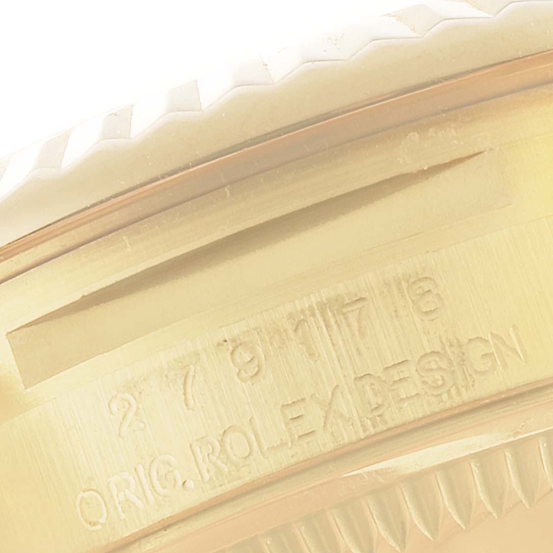 This image shows a close-up angle of the case side and serial number engraving on a Rolex President 279178 Women's Yellow Gold Champagne Dial 279178 Women's Yellow Gold Champagne Dial model watch.