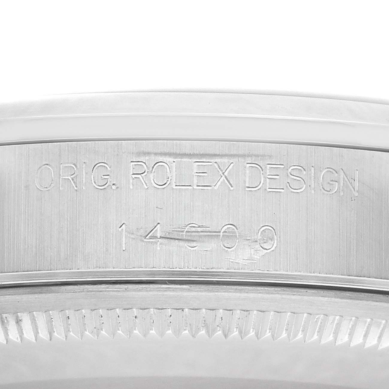 The image shows a close-up of the Rolex Air-King 14000 Men's Stainless Steel Black Dial 14000 Men's Stainless Steel Black Dial model's case, featuring the engraved reference number and design markings.