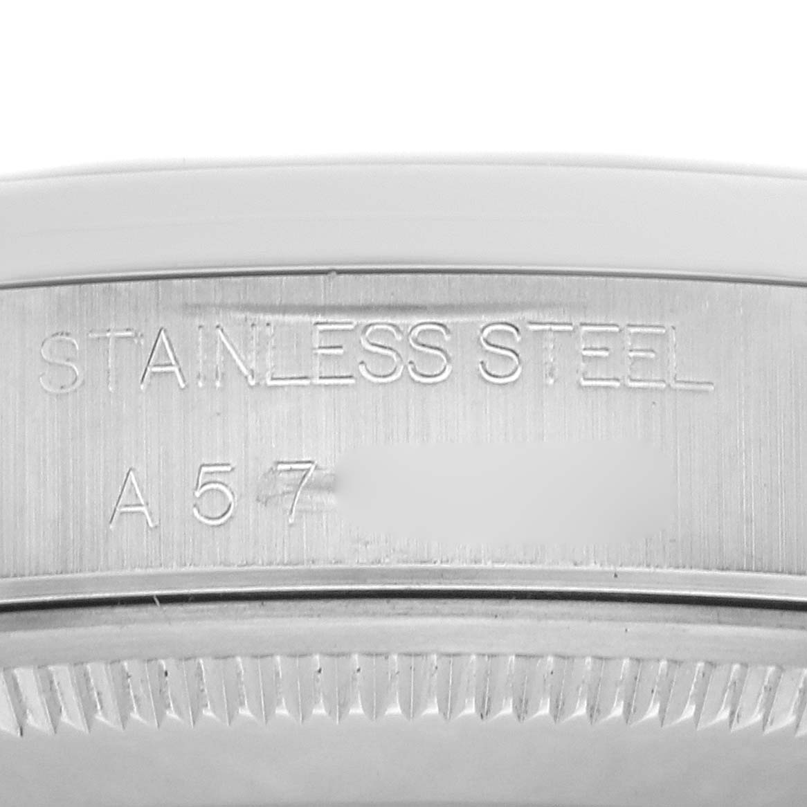 The image shows a close-up of the Rolex Air-King 14000 Men's Stainless Steel Black Dial 14000 Men's Stainless Steel Black Dial's stainless steel case with engraved text.