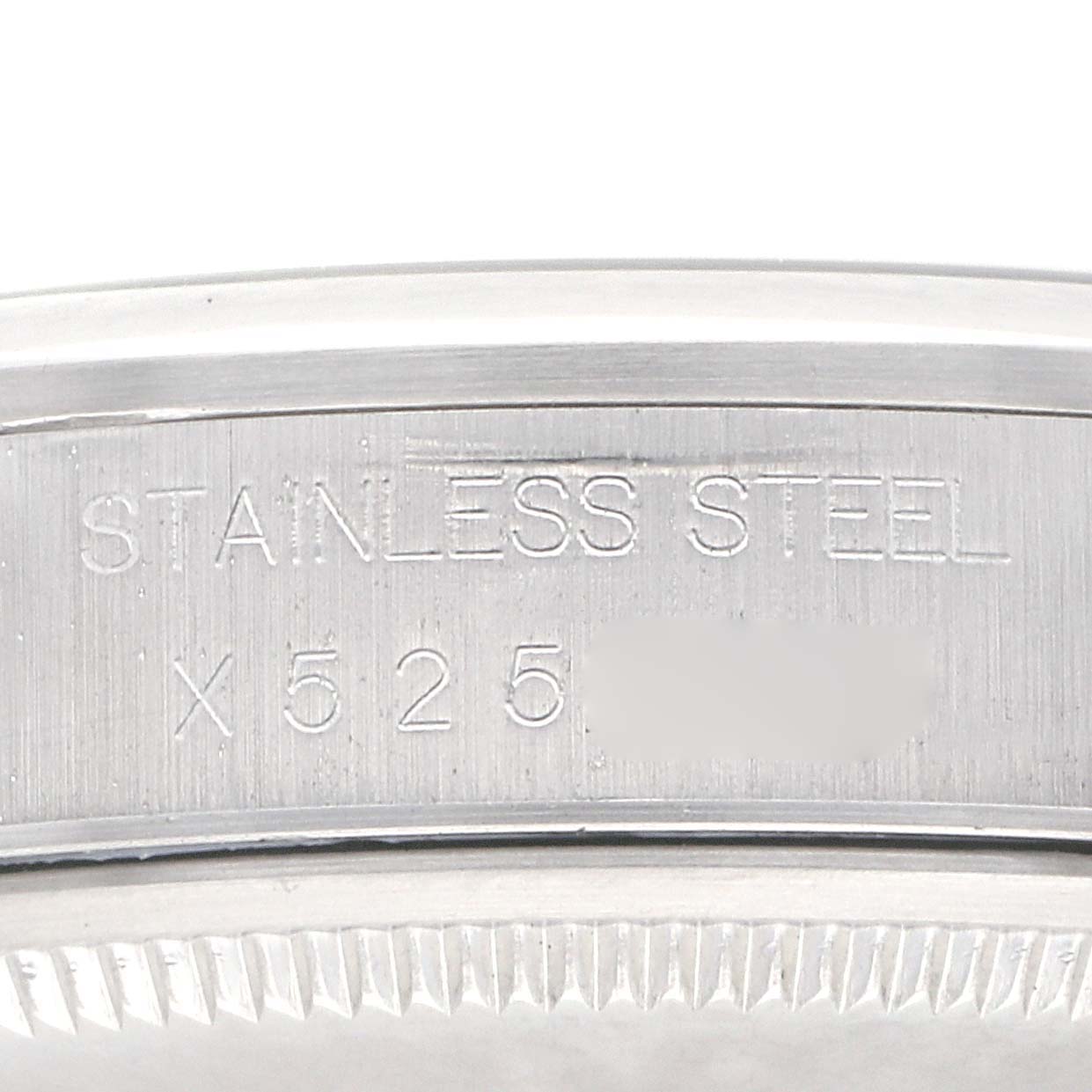 The image shows a close-up of the case back of a Rolex Air-King 14000 Men's Stainless Steel Blue Dial 14000 Men's Stainless Steel Blue Dial with "STAINLESS STEEL" engraved.