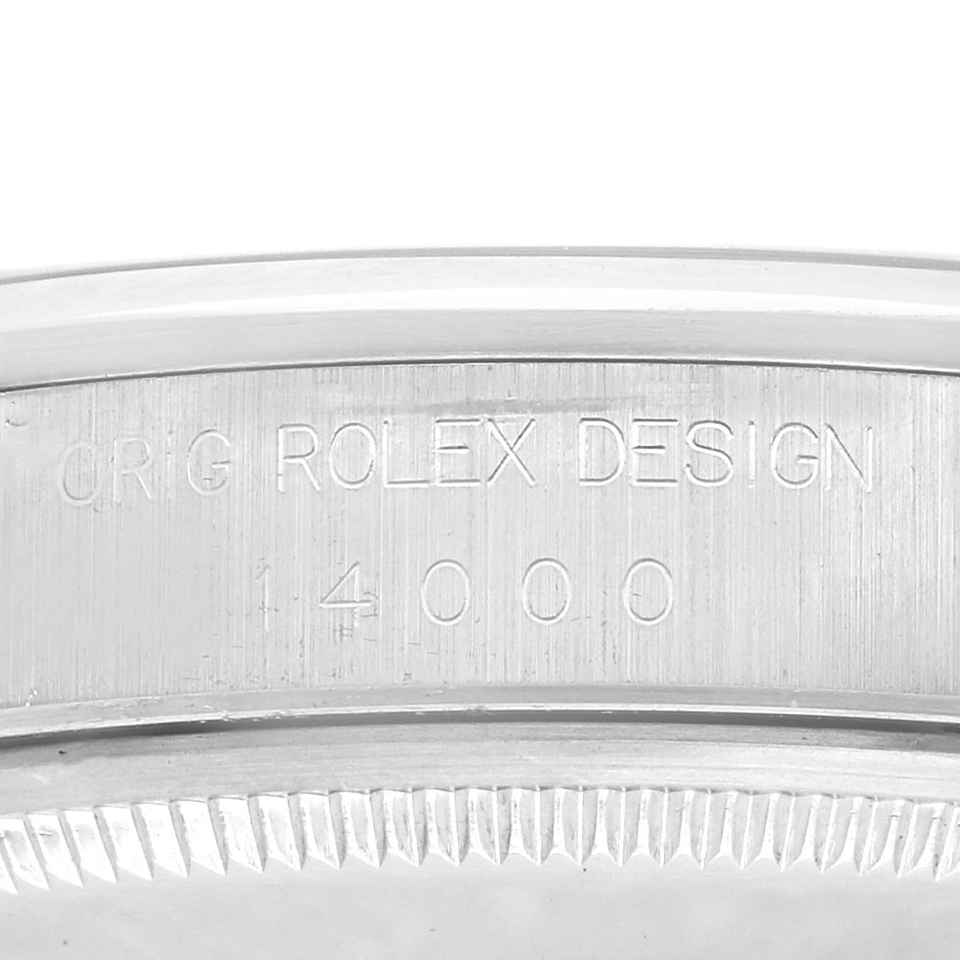 The image shows a close-up of the case side engraving on a Rolex Air-King 14000 Men's Stainless Steel Blue Dial 14000 Men's Stainless Steel Blue Dial watch, displaying "ORIG ROLEX DESIGN 14000."