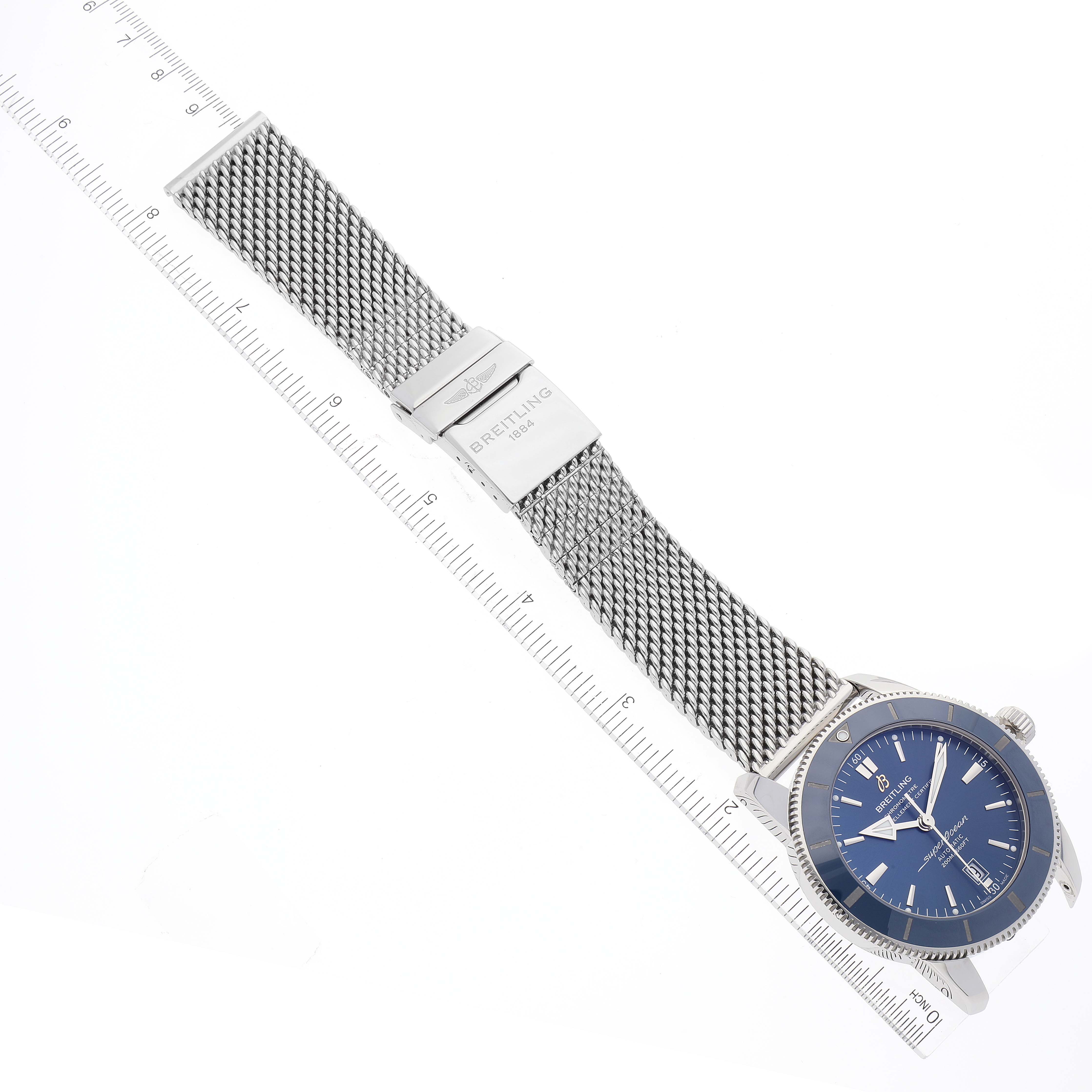 The image shows a Breitling Superocean AB202016-C961-152A Men's Stainless Steel Blue Dial AB202016-C961-152A Men's Stainless Steel Blue Dial watch laid flat, including the mesh strap and clasp, alongside a ruler for size reference.