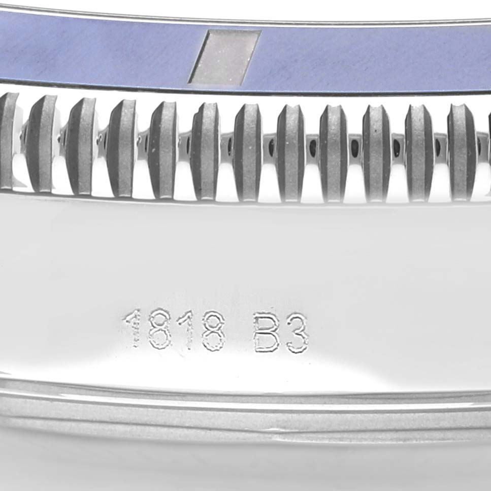 This image shows the side profile of a Breitling Superocean AB202016-C961-152A Men's Stainless Steel Blue Dial AB202016-C961-152A Men's Stainless Steel Blue Dial watch crown, bezel, and part of the case, including an engraving.