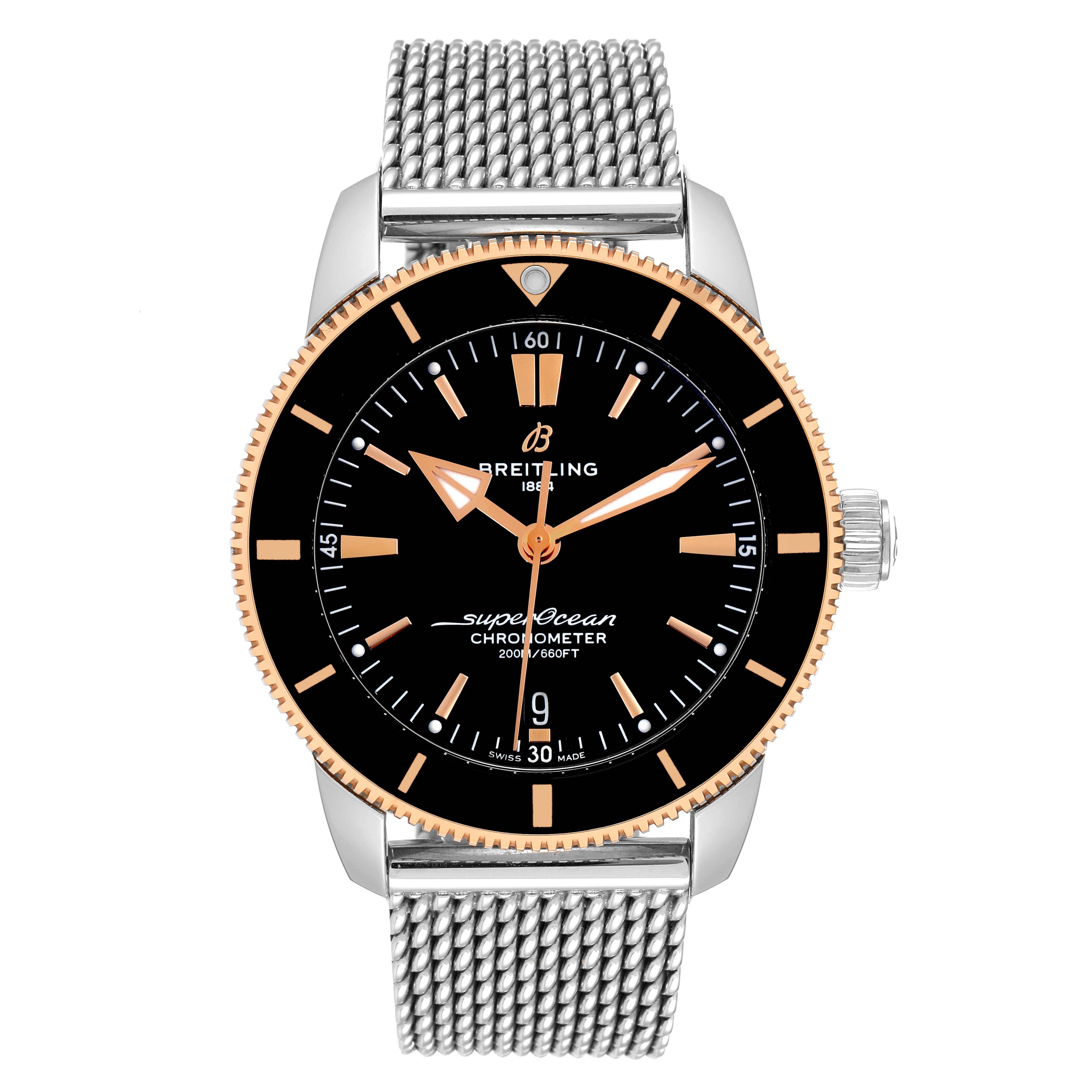 This image shows a front view of the Breitling Superocean UB2030121B1A1 Men's Steel and Gold (two tone) Black Dial UB2030121B1A1 Men's Steel and Gold (two tone) Black Dial watch, displaying its black dial, markers, and metal mesh strap.