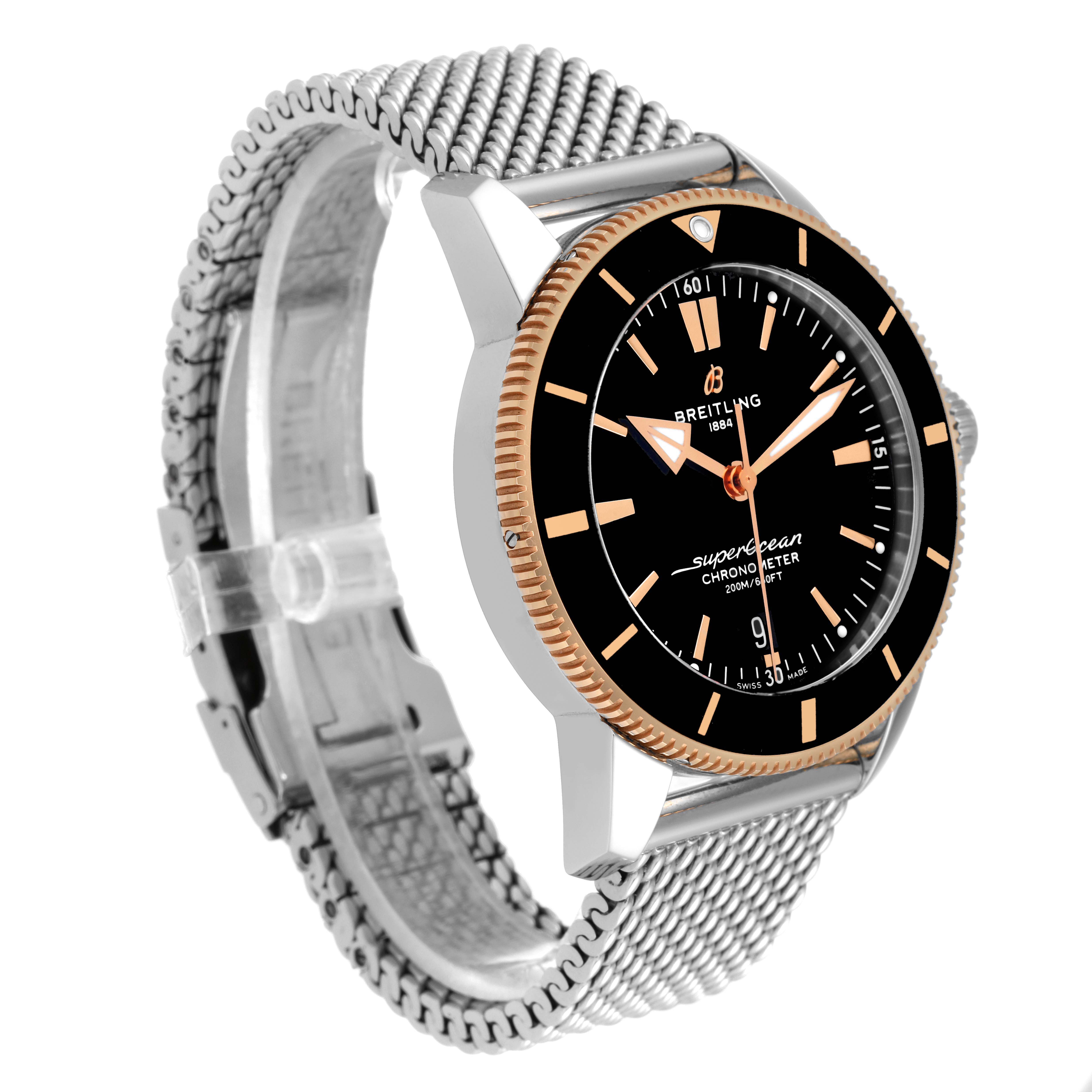 The image shows a Breitling Superocean UB2030121B1A1 Men's Steel and Gold (two tone) Black Dial UB2030121B1A1 Men's Steel and Gold (two tone) Black Dial watch at a three-quarter angle, featuring its face, bezel, and metal mesh strap.