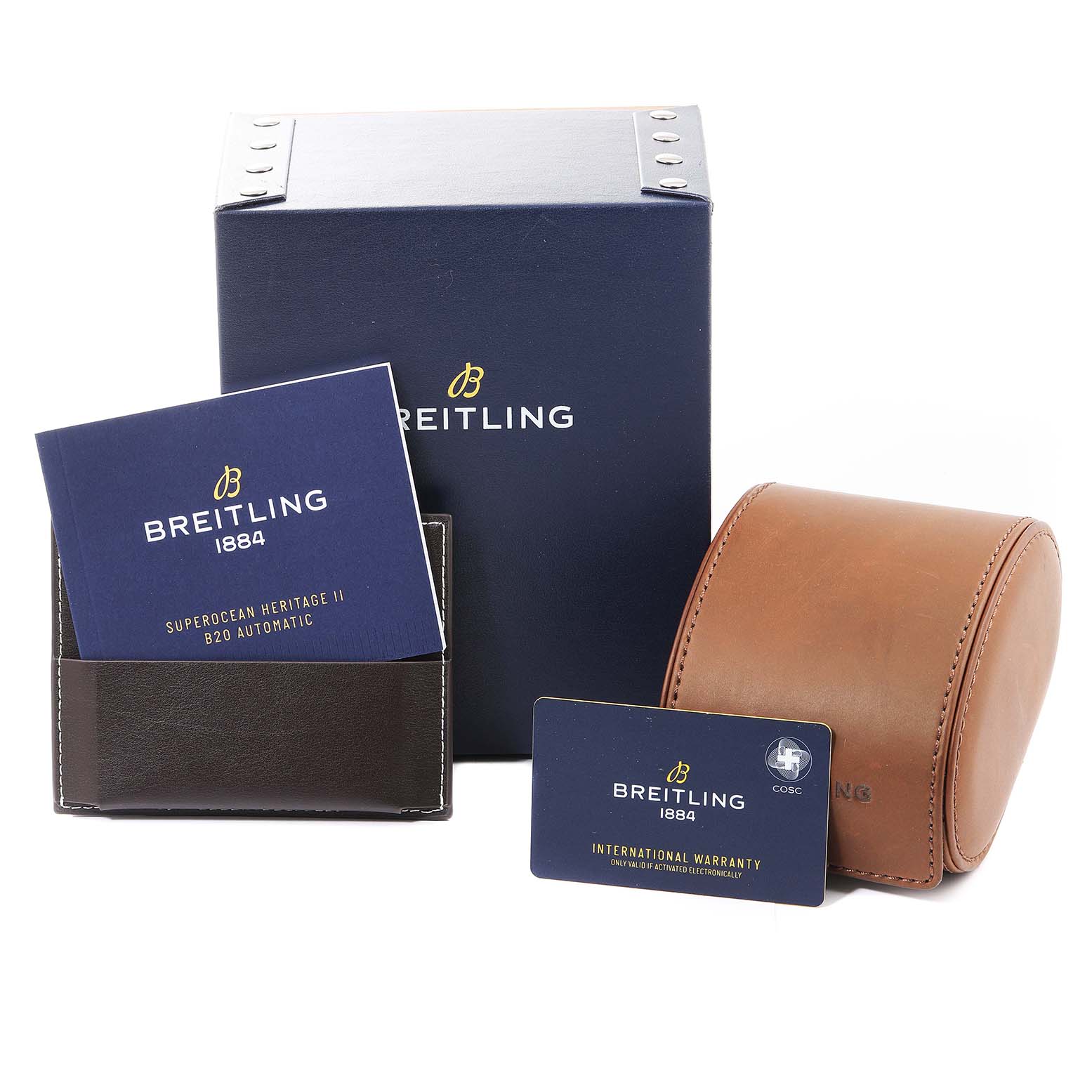 This image shows the Breitling Superocean UB2030121B1A1 Men's Steel and Gold (two tone) Black Dial UB2030121B1A1 Men's Steel and Gold (two tone) Black Dial Heritage II B20 Automatic box, manual, warranty card, and a leather travel case.