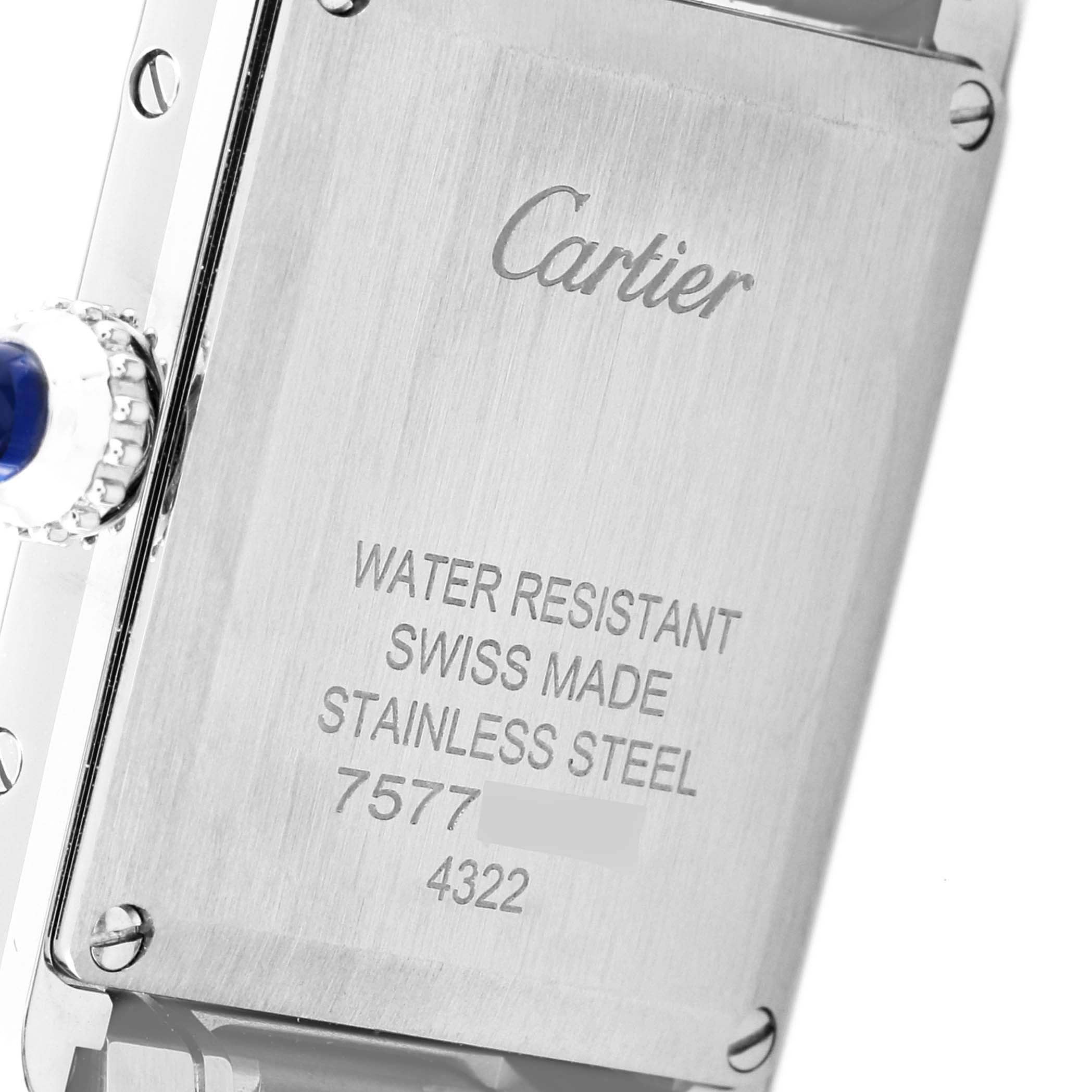 This image shows the back case of a Cartier Tank Must WSTA0051 Women's Stainless Steel Silver Dial WSTA0051 Women's Stainless Steel Silver Dial watch, highlighting its water resistance, Swiss origin, and stainless steel construction.