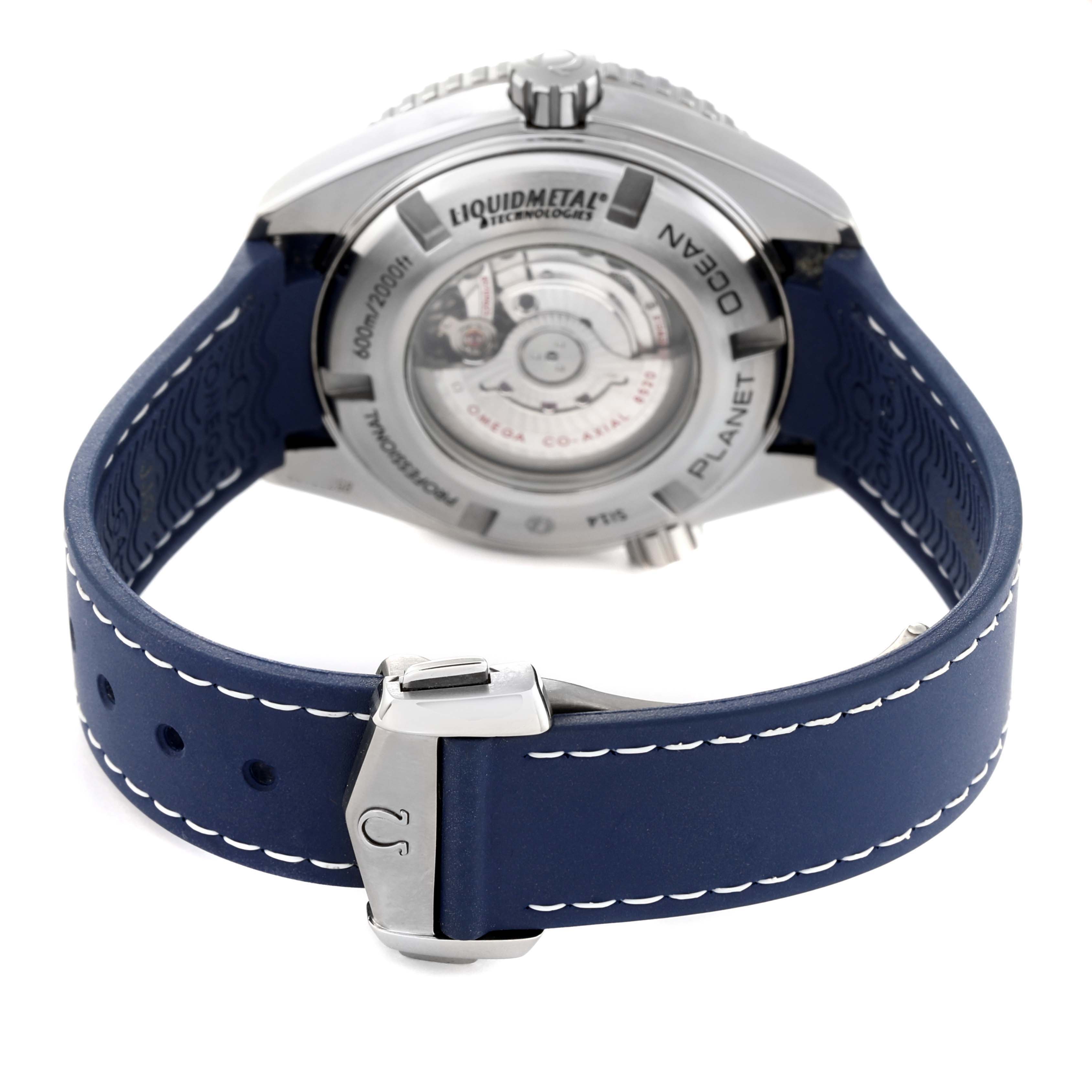 The image shows the back view of the Omega Planet Ocean 232.92.38.20.03.001 Men's Titanium Blue Dial 232.92.38.20.03.001 Men's Titanium Blue Dial watch, highlighting the back case and blue strap with its clasp.