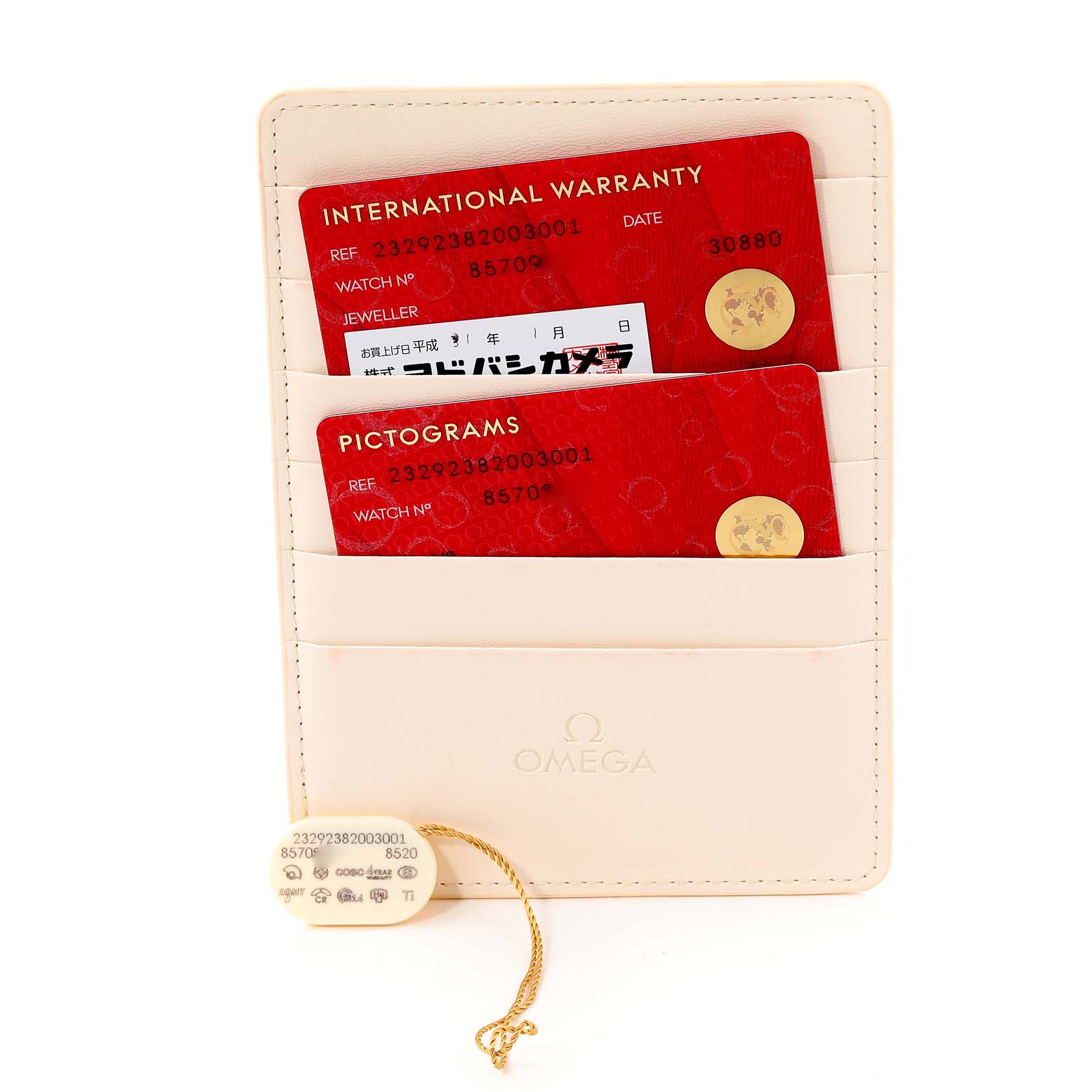 The image shows an Omega Planet Ocean 232.92.38.20.03.001 Men's Titanium Blue Dial 232.92.38.20.03.001 Men's Titanium Blue Dial model's warranty cards and accompanying documentation holder, along with a hang tag.