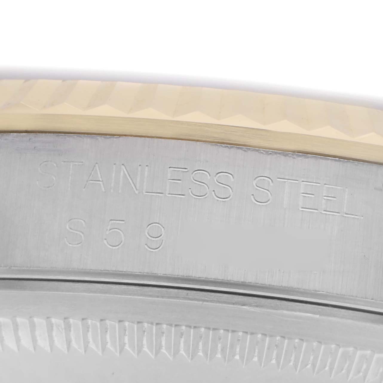 The image shows a close-up of the Rolex Datejust 16233 Men's Steel and Gold (two tone) White Dial 16233 Men's Steel and Gold (two tone) White Dial's case, highlighting the stainless steel material and a portion of the bezel.