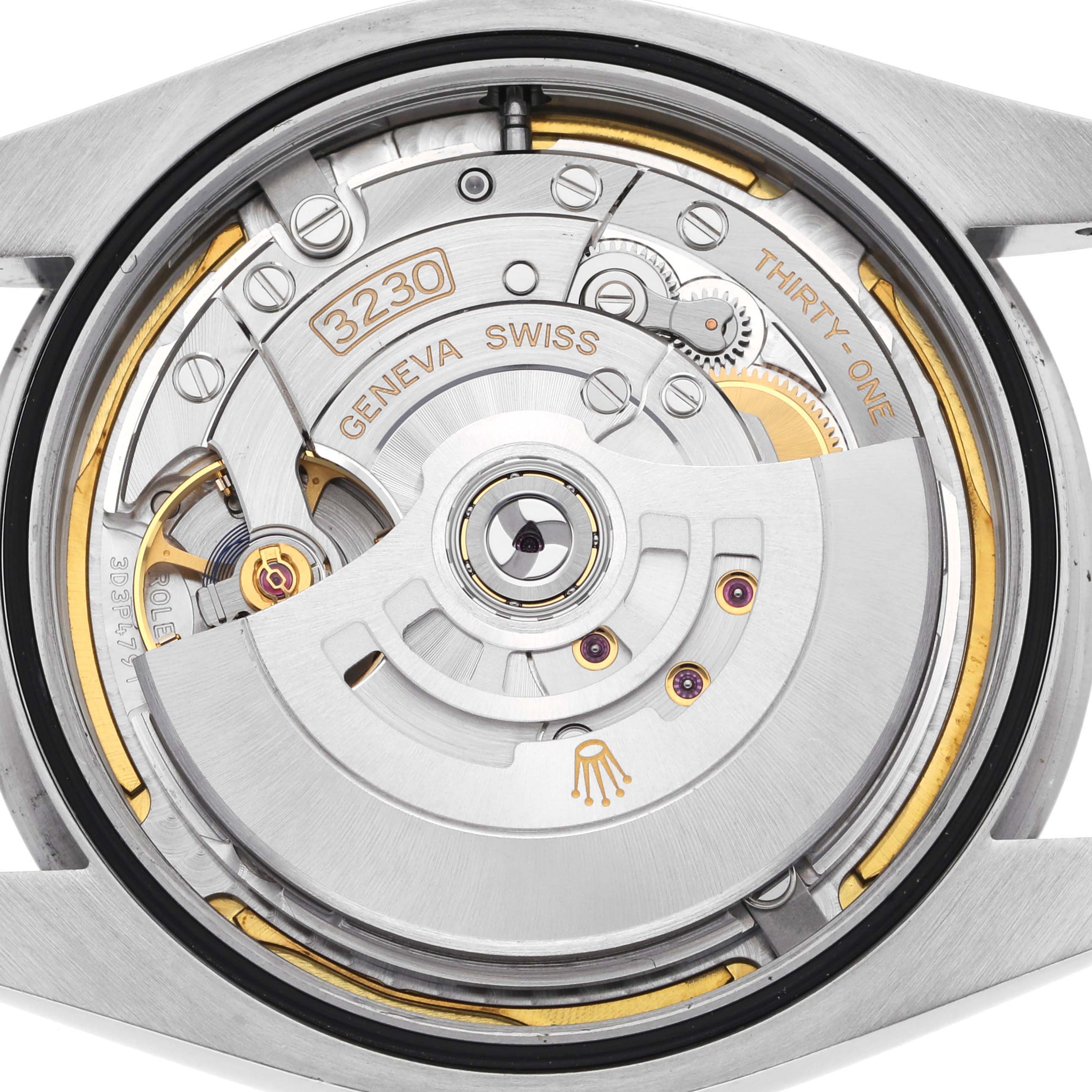 The image shows the Rolex Oyster Perpetual 124300 Men's Stainless Steel Green Dial 124300 Men's Stainless Steel Green Dial's movement from a top-down angle, highlighting the rotor and mechanical components.