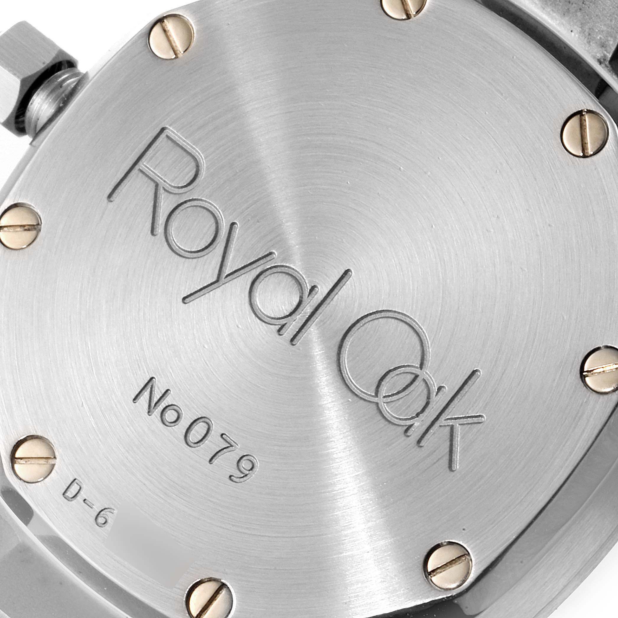 The image shows the engraved case back of the Royal Oak model by Audemars Piguet, featuring the model name and screws.