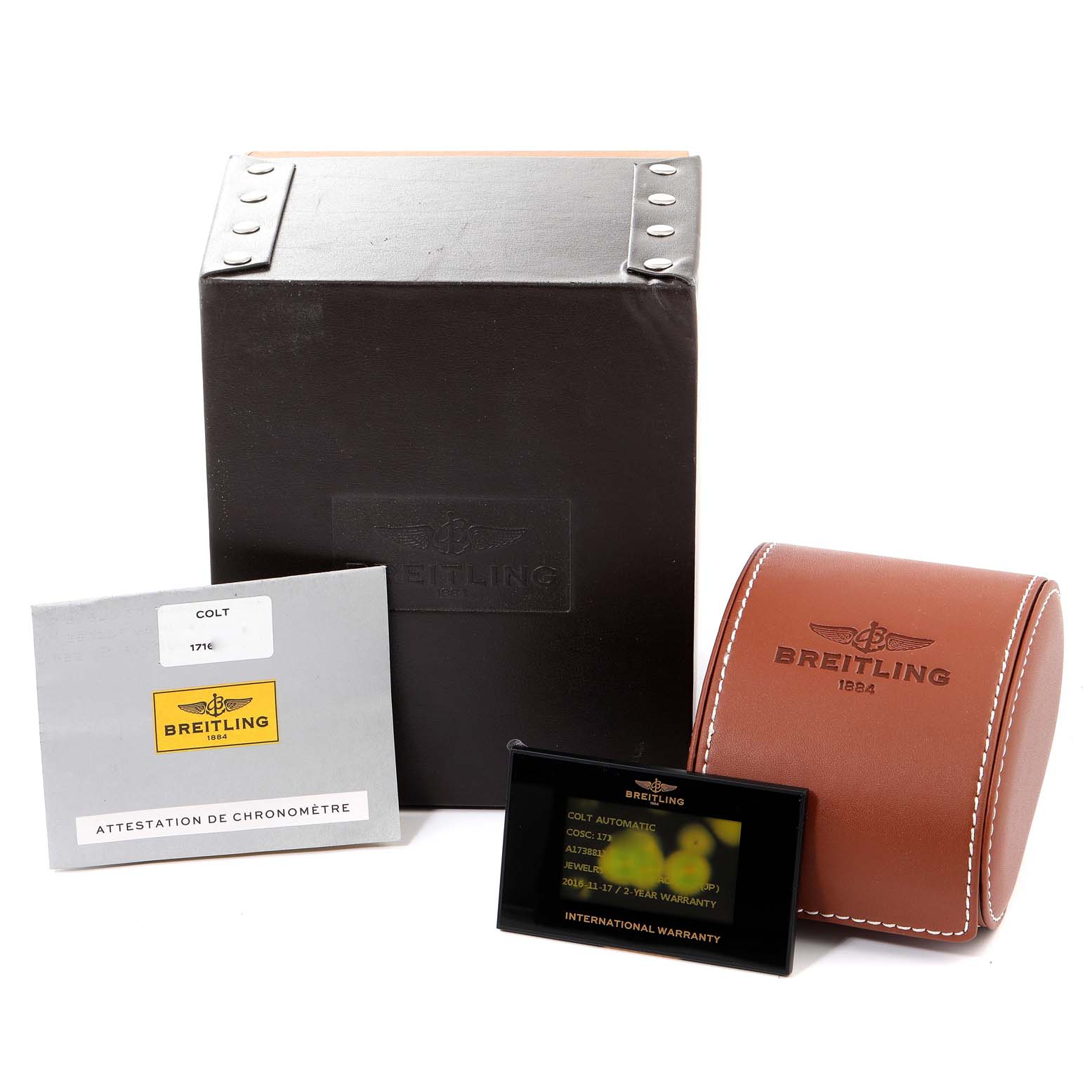 The image shows the packaging, warranty card, case, and documentation for a Breitling Colt A17388 Men's Stainless Steel White Dial A17388 Men's Stainless Steel White Dial watch.