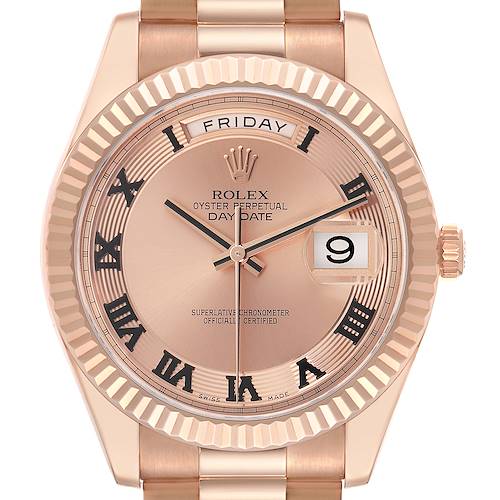 The Rolex President 218235 Men's Rose Gold Pink Dial 218235 Men's Rose Gold Pink Dial model is shown from the front, featuring the dial, hands, day and date windows, and crown.