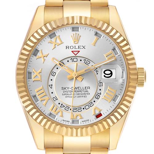The Rolex Sky-Dweller 326938 Men's Yellow Gold Silver Dial 326938 Men's Yellow Gold Silver Dial watch is shown from a front angle, highlighting its dial, bezel, hour markers, and cyclops lens over the date.