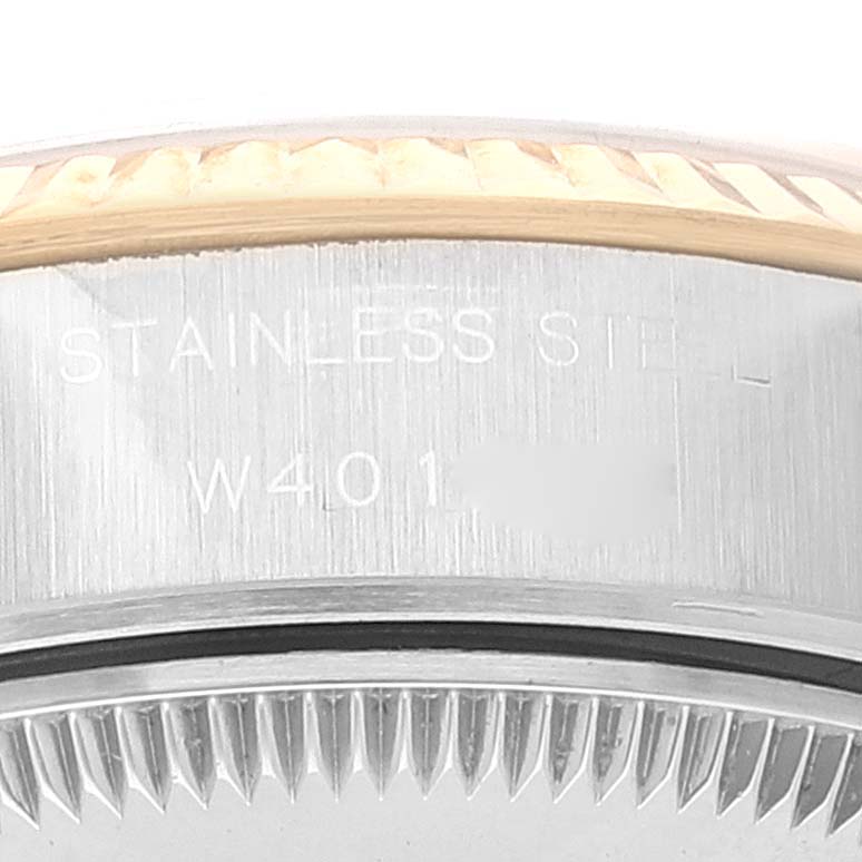 This image shows a close-up of the side and part of the bezel of a Rolex Datejust 69173 Women's Steel and Gold (two tone) White Dial 69173 Women's Steel and Gold (two tone) White Dial watch, with "STAINLESS STEEL" engraved.