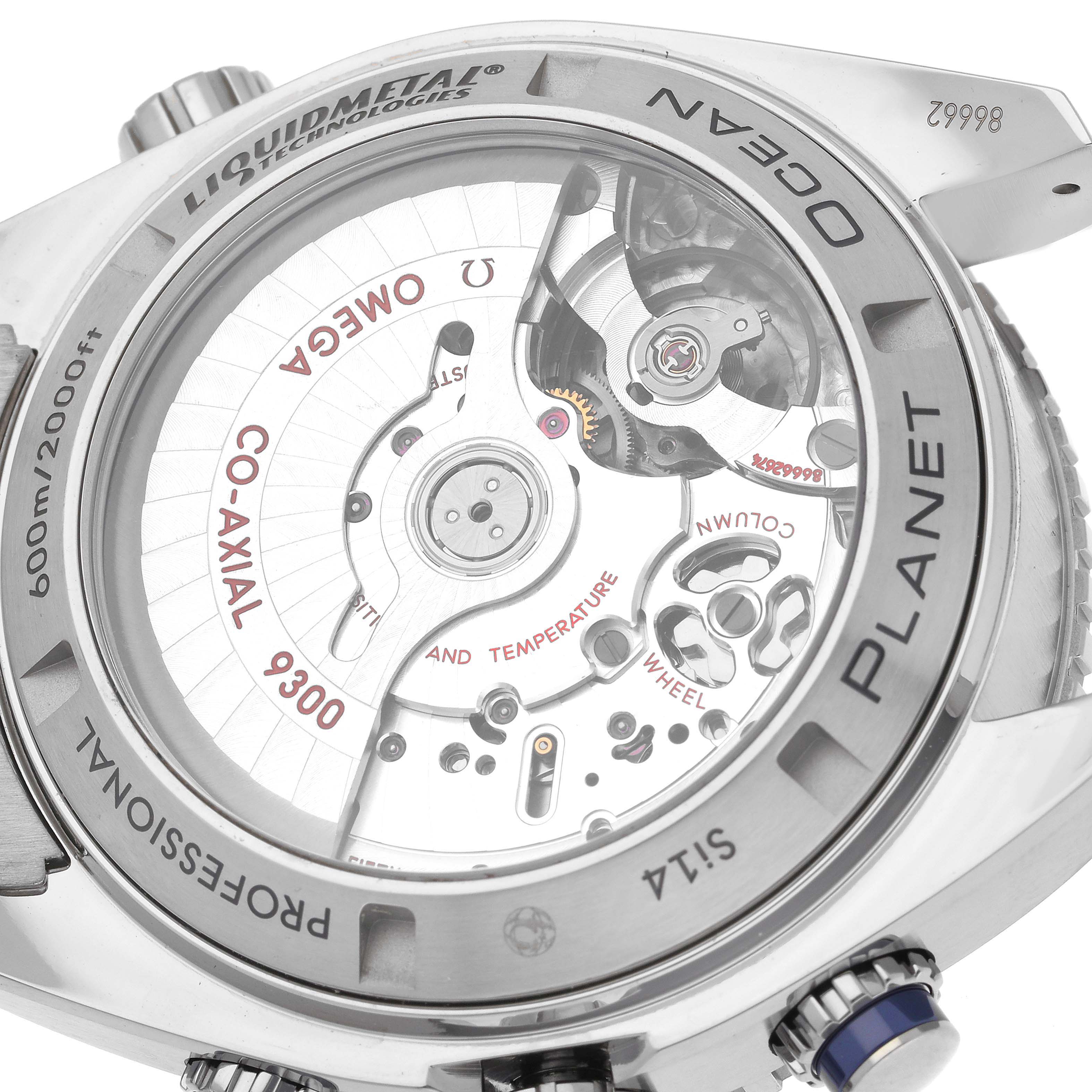 The image shows the back side of the Omega Planet Ocean 232.90.46.51.03.001 Men's Titanium Blue Dial 232.90.46.51.03.001 Men's Titanium Blue Dial watch, highlighting the movement, co-axial mechanism, and Liquidmetal technology.