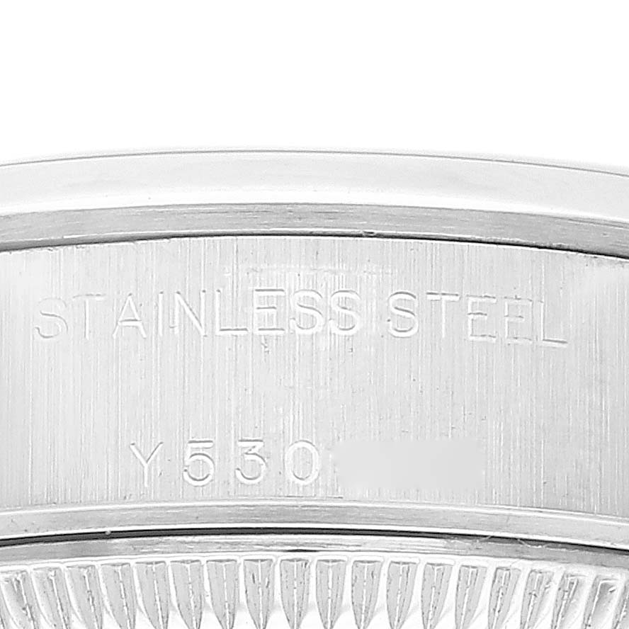 This image shows a close-up of the stainless steel casing and part of the fluted bezel of a Rolex Date 79160 Women's Stainless Steel White Dial 79160 Women's Stainless Steel White Dial model watch.