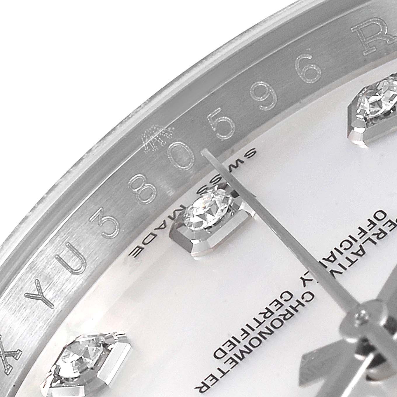 This image shows a close-up of the Rolex Datejust 116244 Men's Stainless Steel Mother of Pearl Dial 116244 Men's Stainless Steel Mother of Pearl Dial watch dial, highlighting the serial number and diamond hour markers.