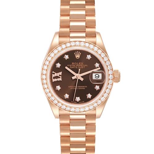 This Rolex President 279135 Women's Rose Gold Brown Dial 279135 Women's Rose Gold Brown Dial model watch is shown from a top-down angle, displaying its bezel, dial, strap, and date window.