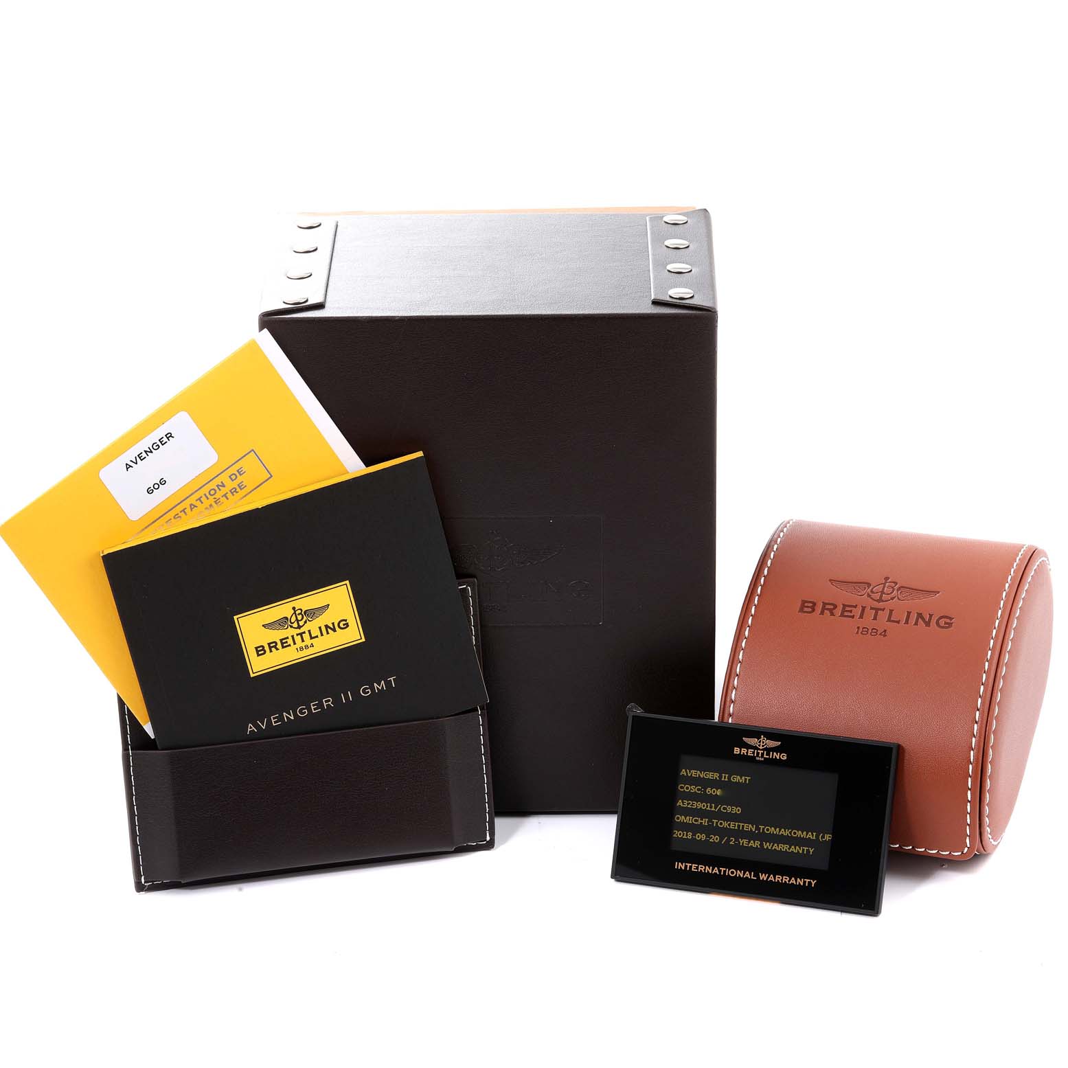 This image shows packaging, manuals, warranty card, and a brown leather case for the Breitling Avenger A3239011-C872-170A Men's Stainless Steel Mother of Pearl Dial A3239011-C872-170A Men's Stainless Steel Mother of Pearl Dial II GMT watch.