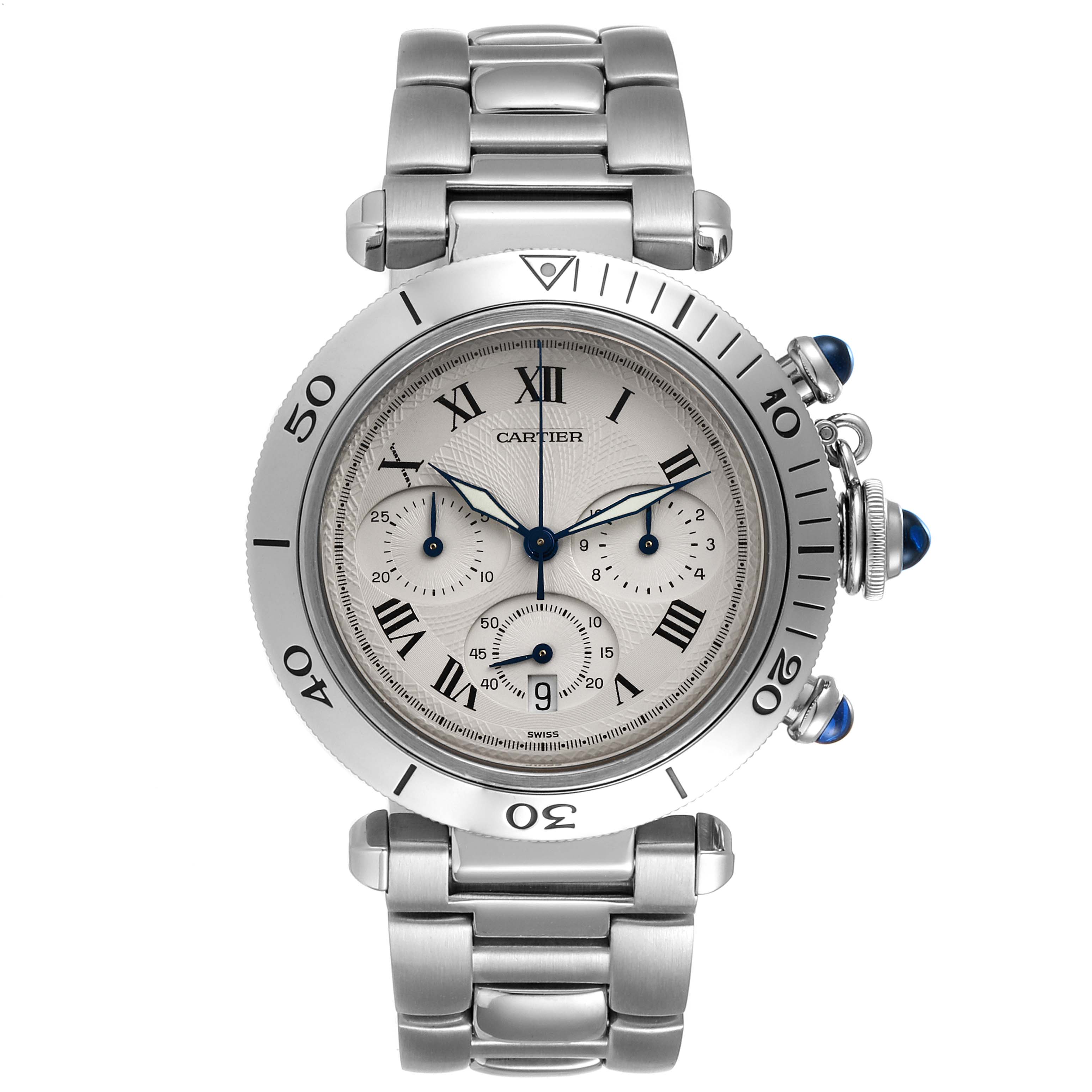 The image shows a frontal view of a Cartier Pasha W31018H3 Men's Stainless Steel Silver Dial W31018H3 Men's Stainless Steel Silver Dial watch displaying its face, bracelet, and crown with blue cabochon.