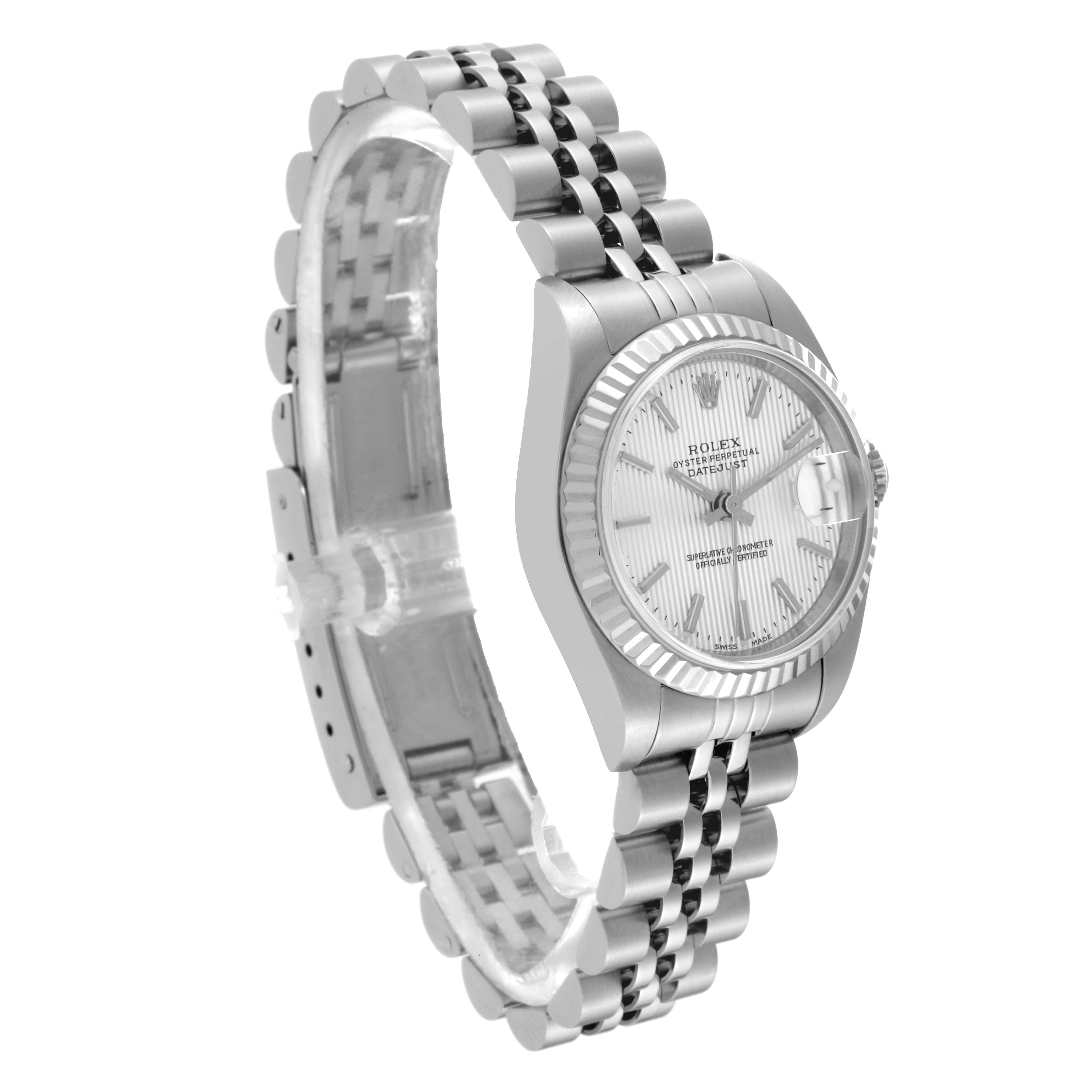 The Rolex Datejust 79174 Women's Stainless Steel Silver Dial 79174 Women's Stainless Steel Silver Dial watch is shown at a slight angle, highlighting the face, fluted bezel, and two-tone Jubilee bracelet.