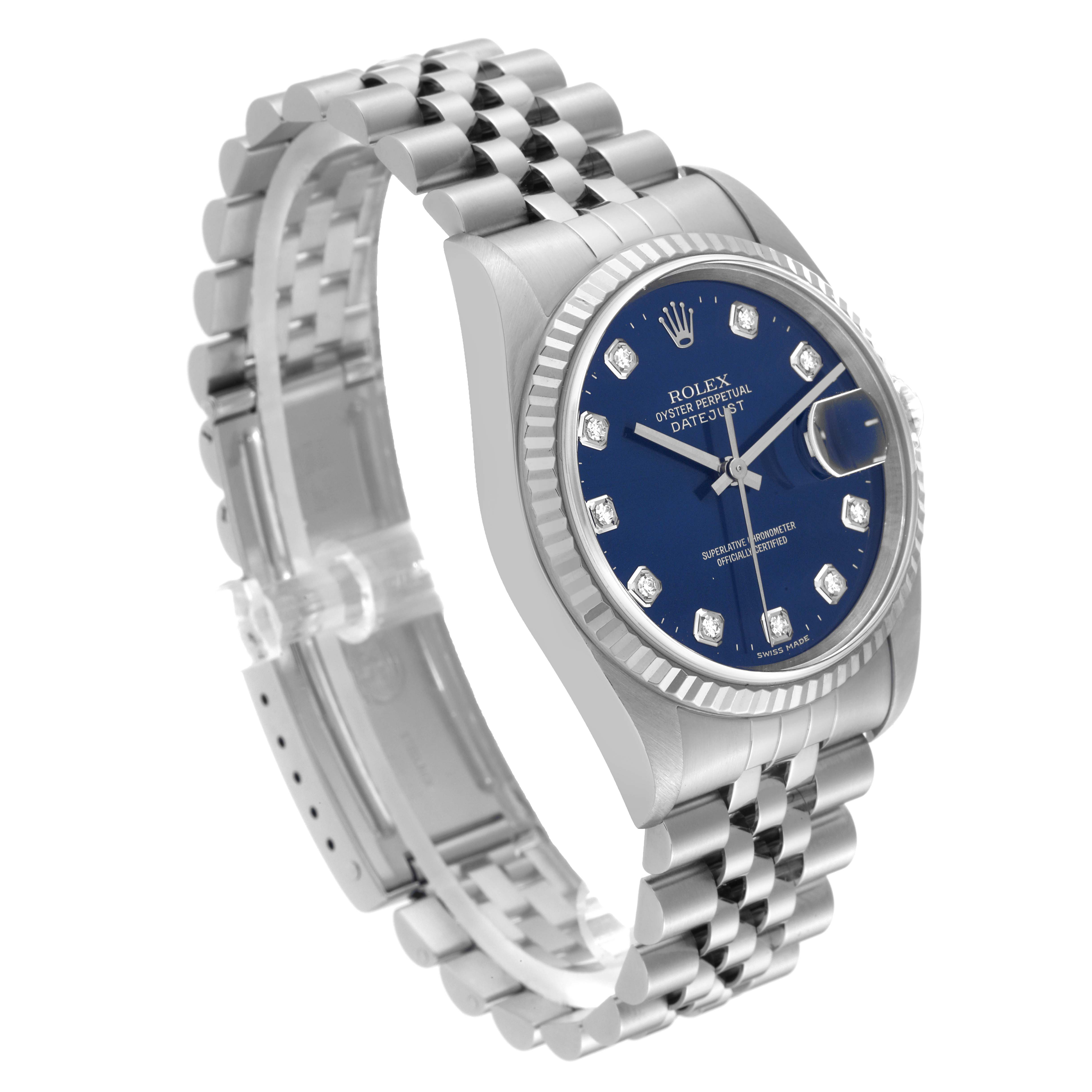 The Rolex Datejust 16234 Men's Stainless Steel Blue Dial 16234 Men's Stainless Steel Blue Dial watch is shown at a slight angle, highlighting its blue dial, diamond hour markers, fluted bezel, and Jubilee bracelet.