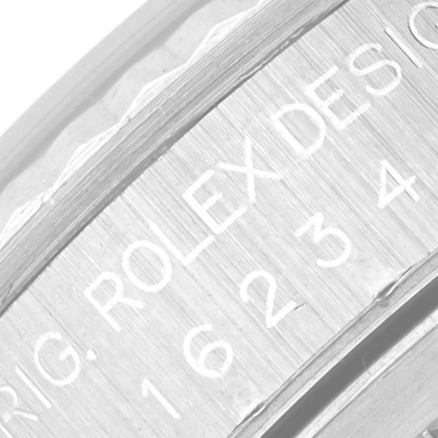 This close-up image shows the engraved inner bezel of a Rolex Datejust 16234 Men's Stainless Steel Blue Dial 16234 Men's Stainless Steel Blue Dial watch, highlighting the brand's name and part of the reference number.