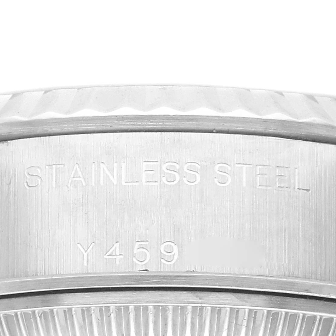 This image shows a close-up of the side of a Rolex Datejust 79174 Women's Stainless Steel Blue Dial 79174 Women's Stainless Steel Blue Dial watch, highlighting the stainless steel material and partially visible serial number.