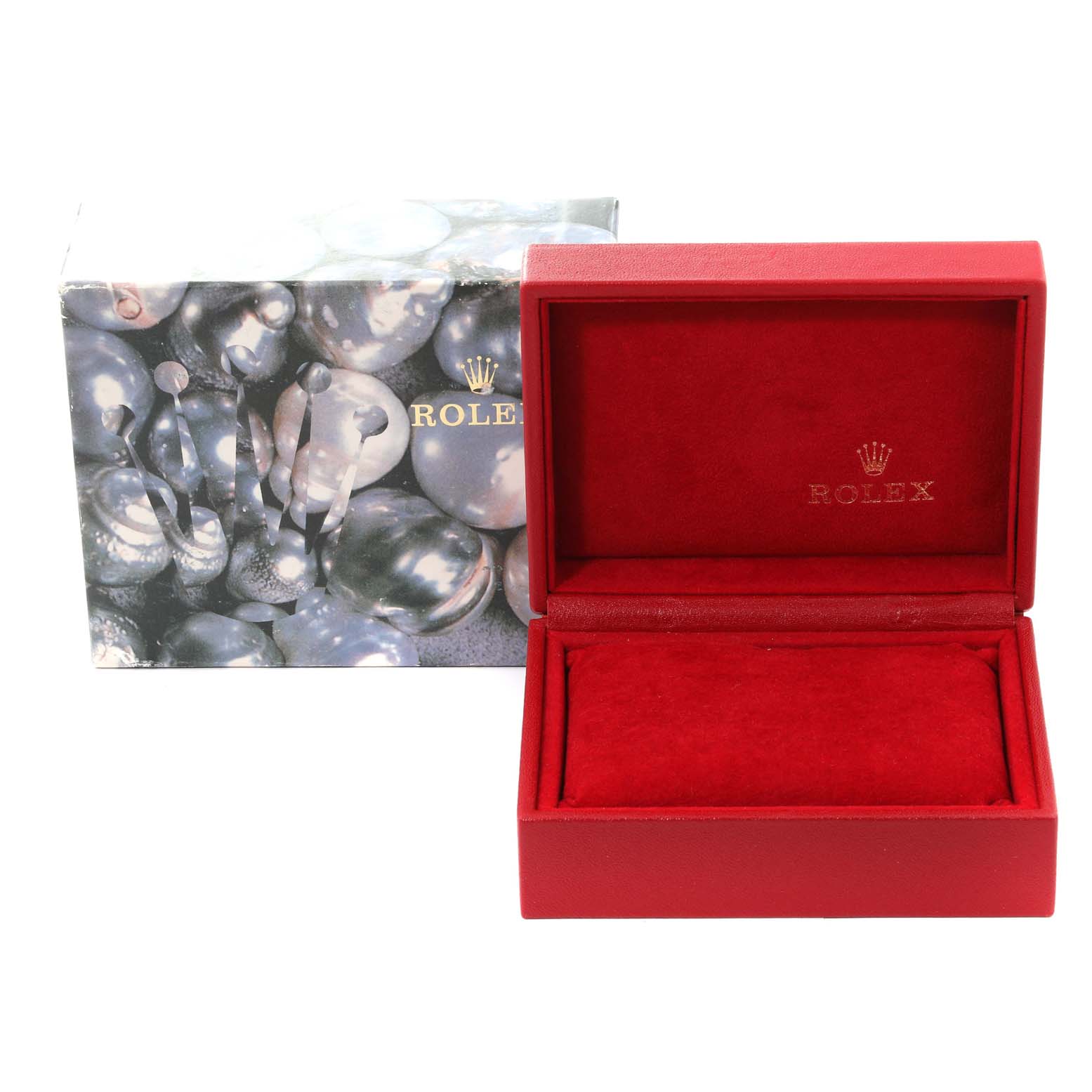 This image shows a red Rolex Datejust 79174 Women's Stainless Steel Silver Dial 79174 Women's Stainless Steel Silver Dial watch box and its outer packaging decorated with reflective spheres.